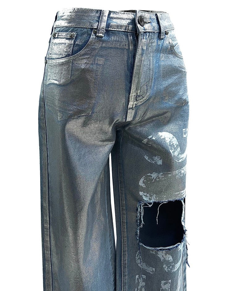 Silver metallic coated denim pants with left front printing and damage points. Made from Cotton 30% /Polyester 70%.