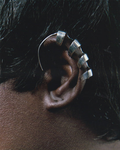Serpentine ear-cuff